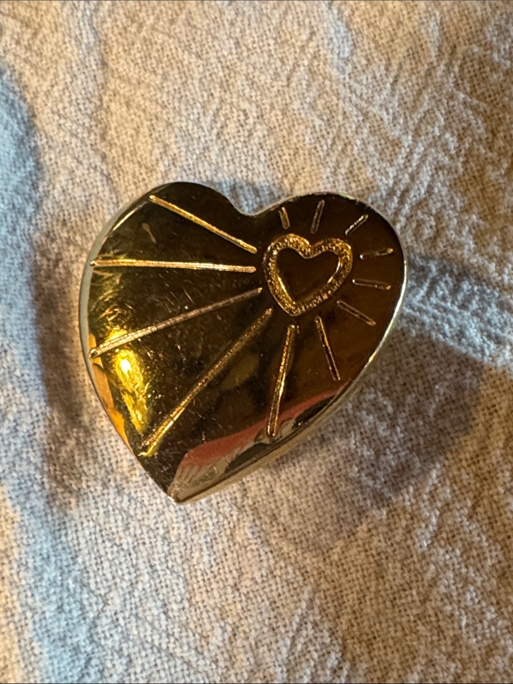 This item is a 1996 Variety Club Gold Heart Pin Badge